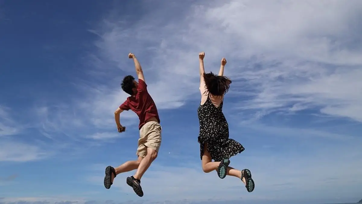 man-and-woman-jumping-in-the-air