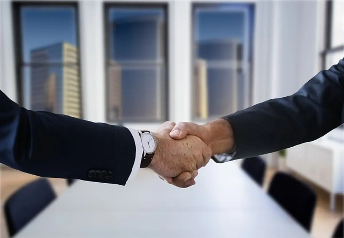 two-businessmen-shake-hands