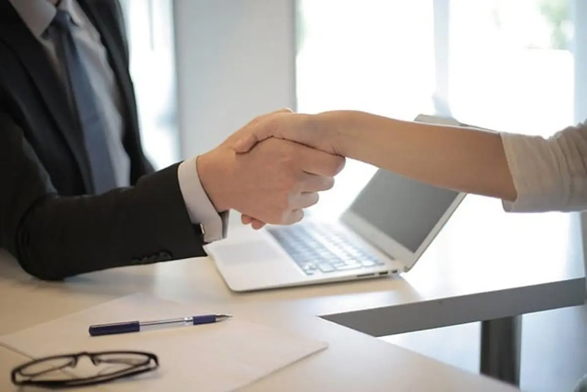 businessman-and-woman-shake-hands