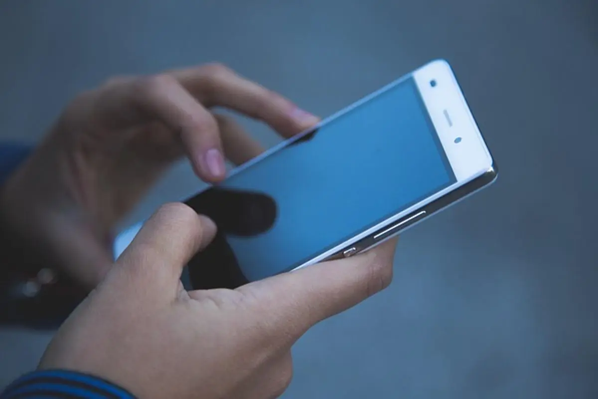 a-person-holding-a-smartphone