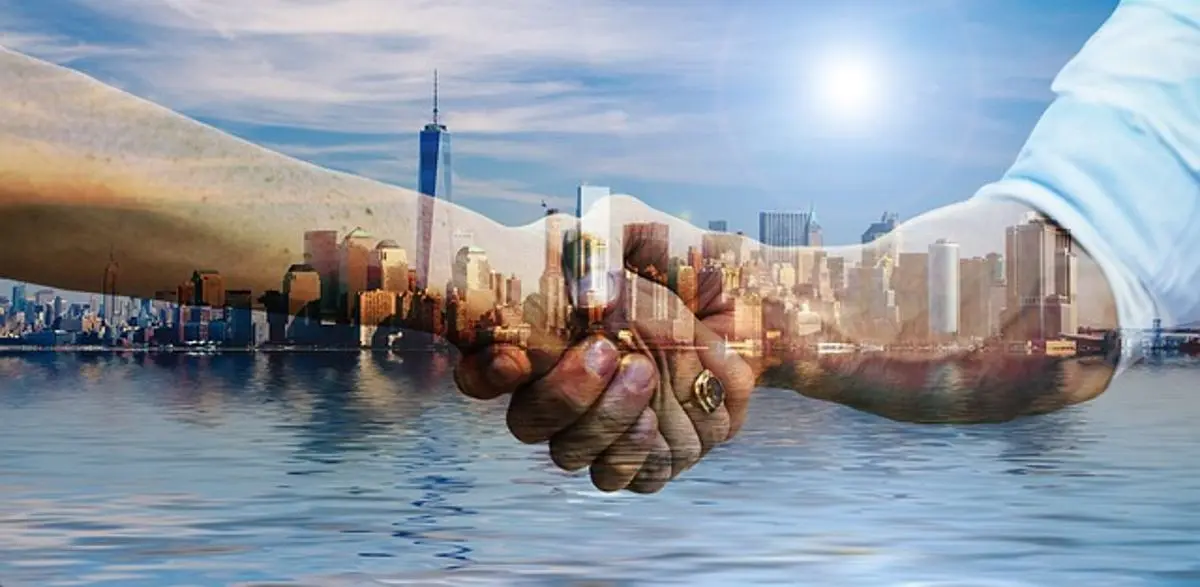 businessman-and-woman-shake-hands