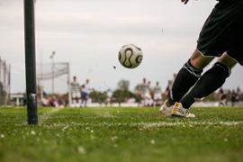 soccer-ball-kicked-by-player