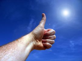 person-holding-thumbs-up-gesture
