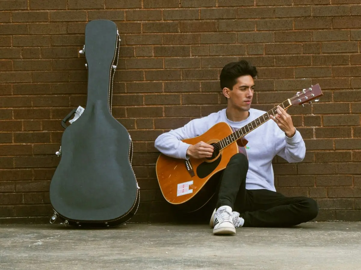 person playing guitar