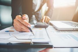 businessman-filling-a-financial-report