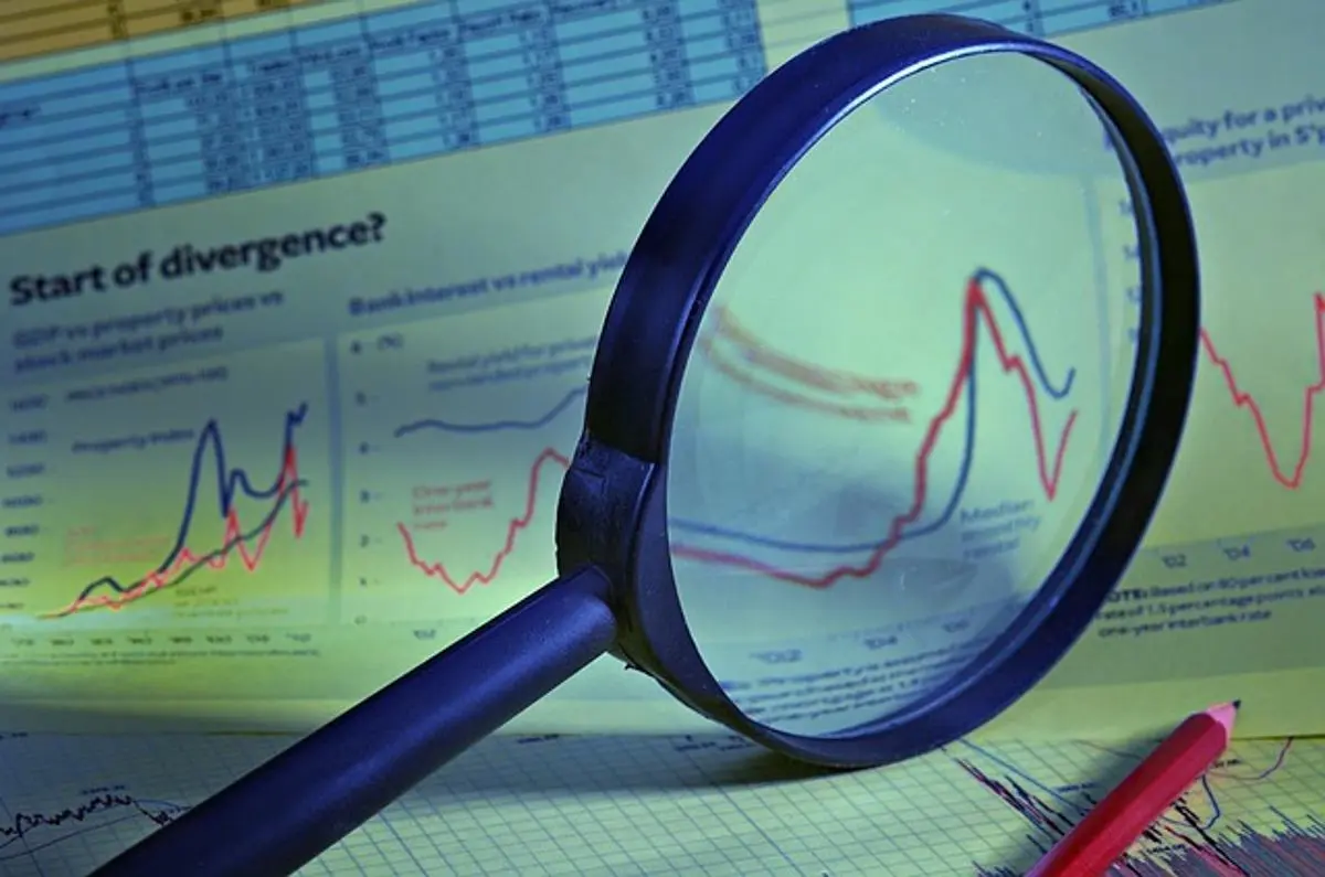 magnifying-glass-and-financial-report