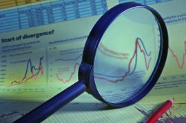 magnifying-glass-and-financial-report