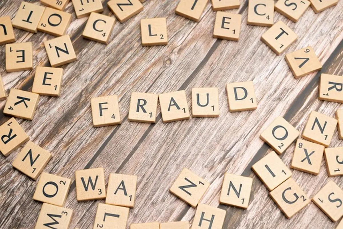 fraud-written-with-scrabble