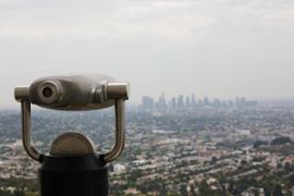 binoculars-and-cityscape-background