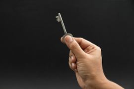 person-holding-a-key