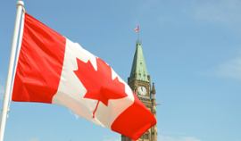 Canadian flag against a provincial backdrop