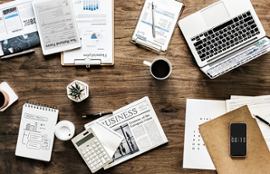 business-desk-with-reports-calculator