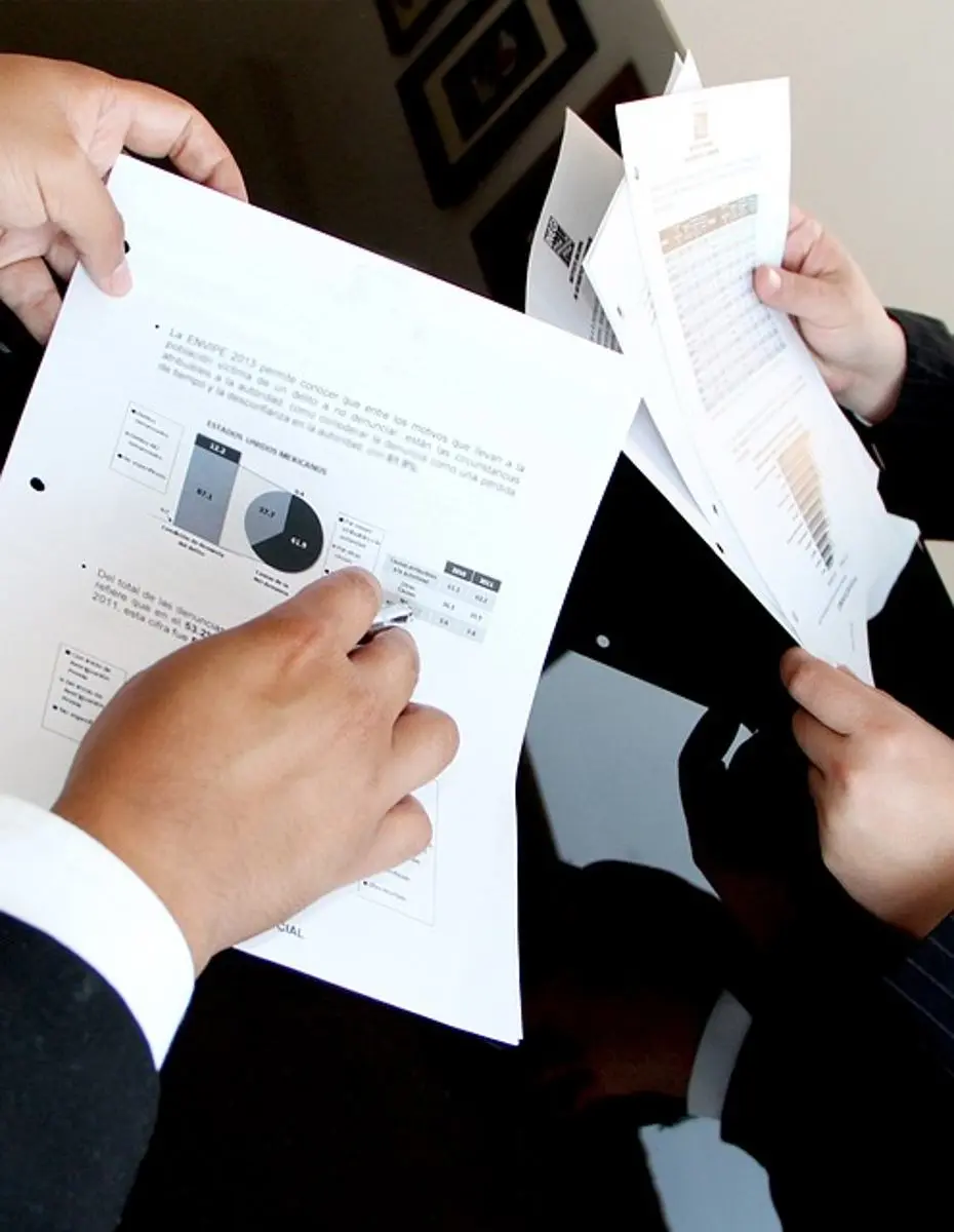 businessmen-reviewing-financial-documents