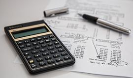 calculator-pen-and-financial-papers