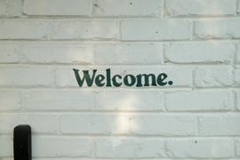 Welcome sign on a wall