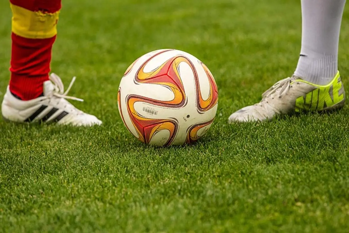 two-football-players-and-ball