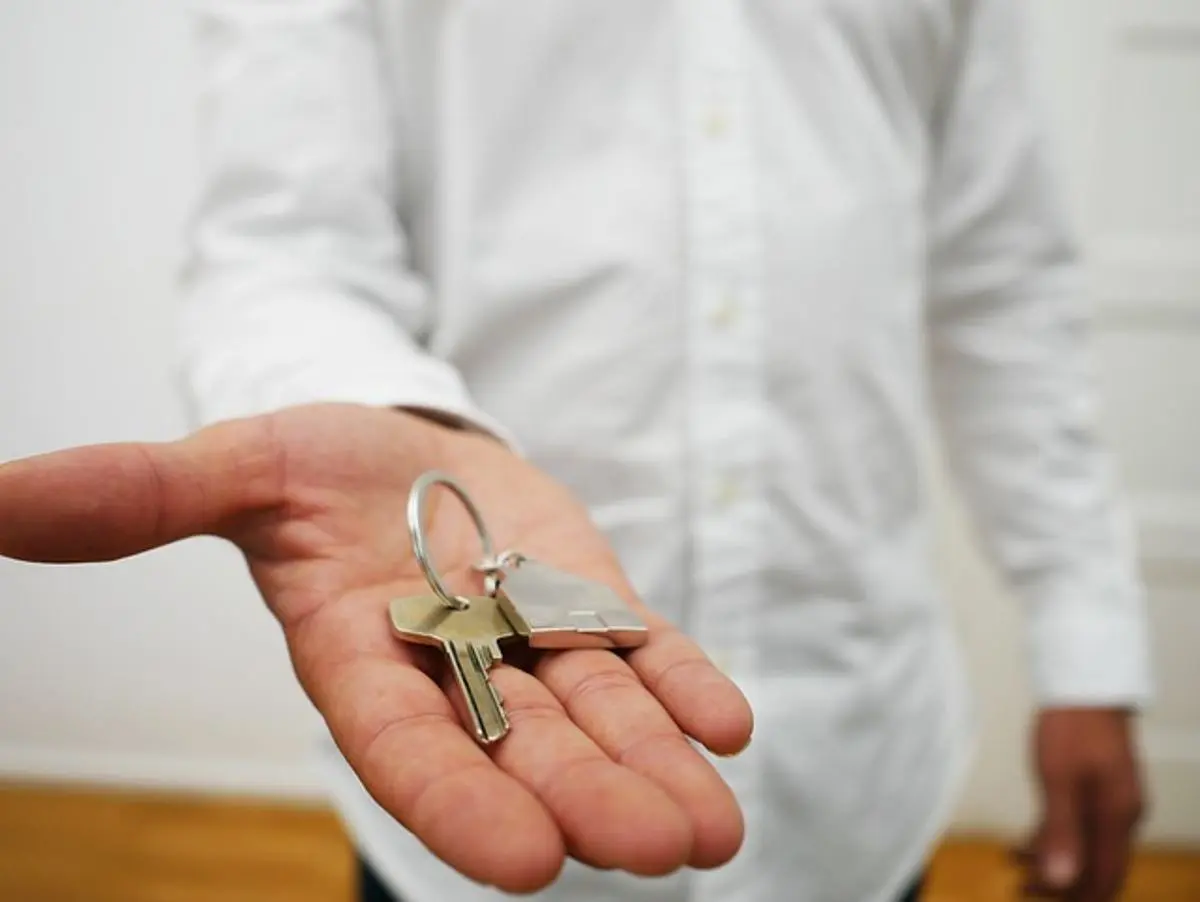 person-handing-out-keys