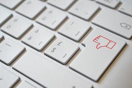 thumb-down-on-keyboard