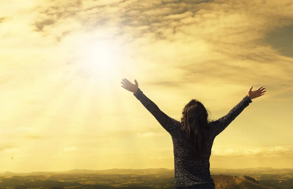 woman-with-hands-up-joy