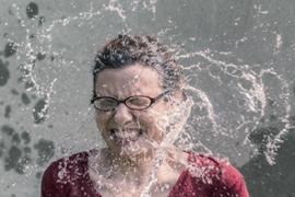 woman-splashed-with-cold-water-in-face
