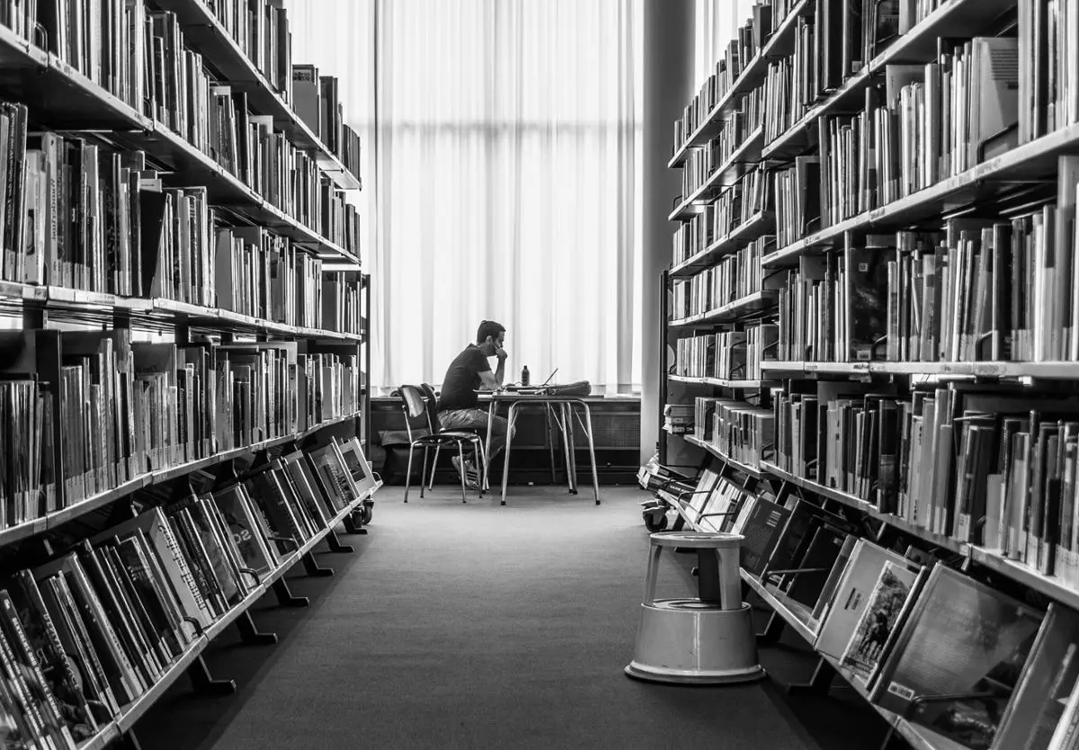 person-in-library-researching-topic