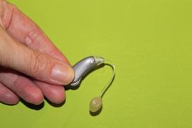 hand-holding-hearing-aid
