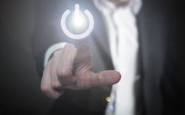 person-pressing-power-button