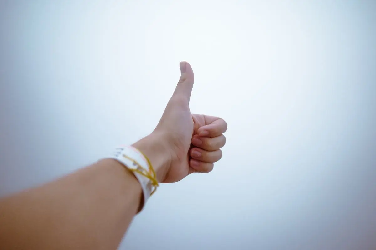 hand-holding-thumbs-up-gesture