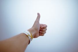 hand-holding-thumbs-up-gesture