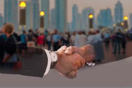 business-team-handshake-cityscape-background