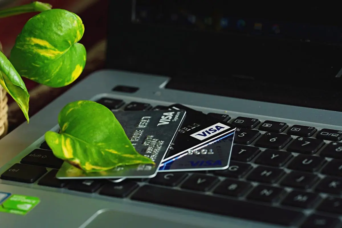 visa-cards-on-top-of-laptop