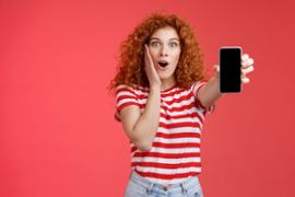 woman-surprised-holding-phone
