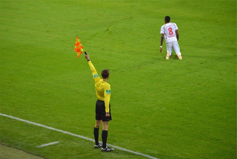a-side-referee-in-soccer-waving-a-flag
