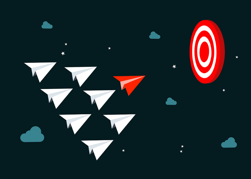 multiple-paper-planes-flying-toward-a-target