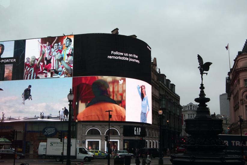 Advertisement on screens in public spaces.