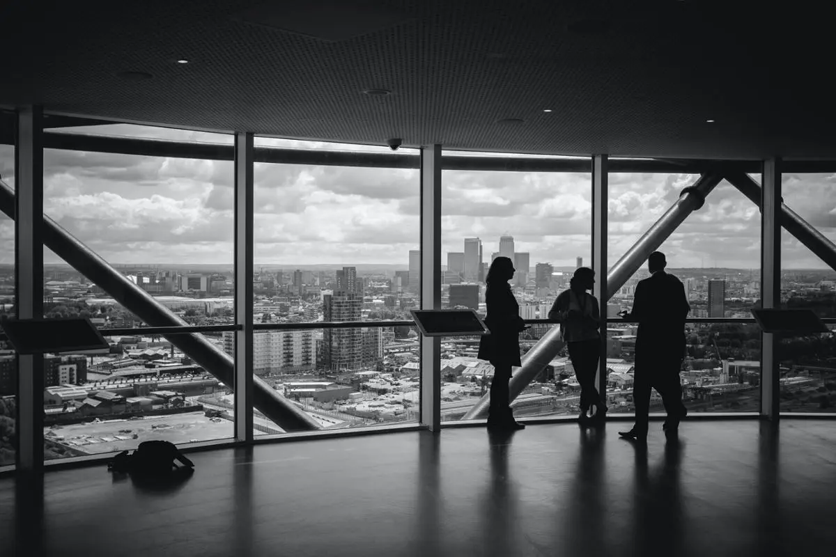 A room of people who discuss a possible business matter.