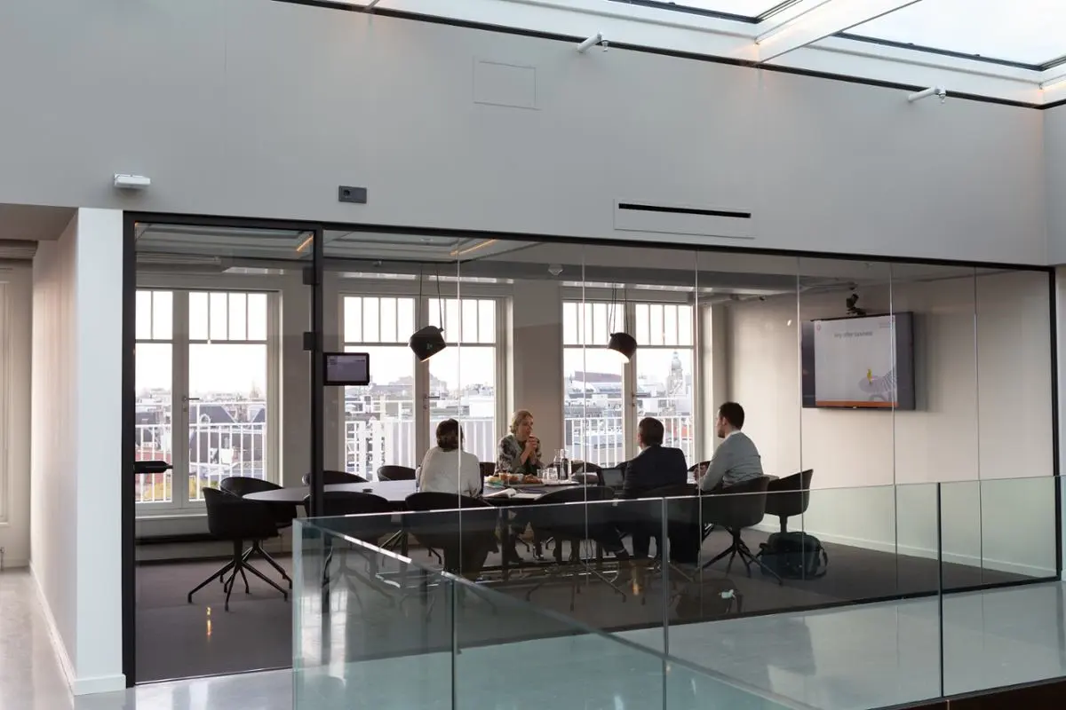 People sitting in a board room.