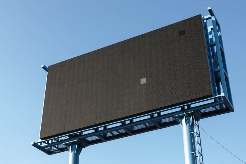An empty billboard in public.