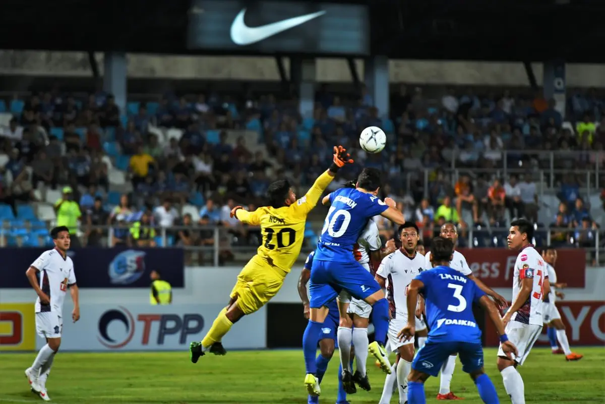 Soccer players vying for control of the ball.