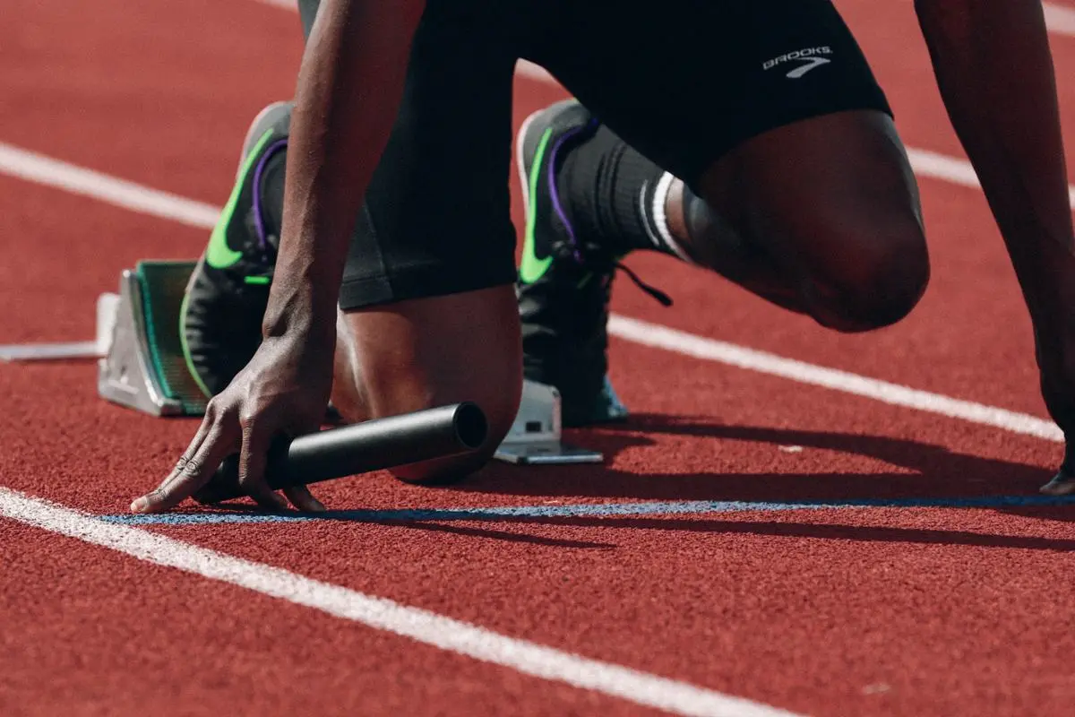 An athlete preparing to run.