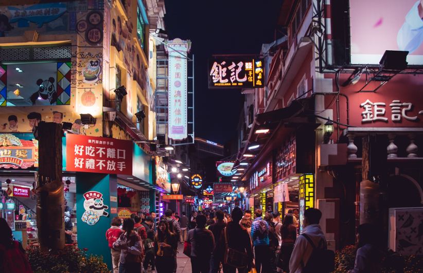 People walking around Macau and shopping.