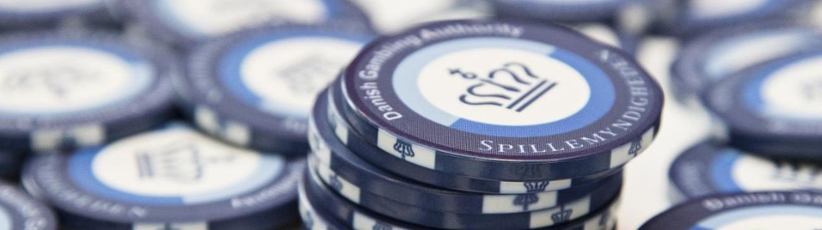 Casino chips with the DGA's logo on them.