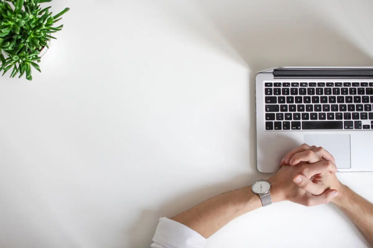 A working person in front of a laptop.