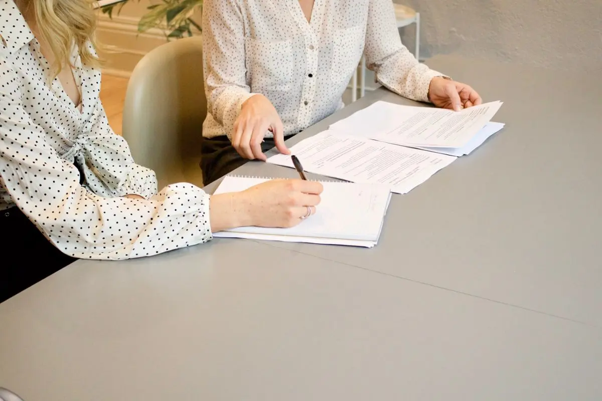 Two people consulting.