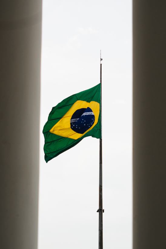 Brazilian flag on a pole.