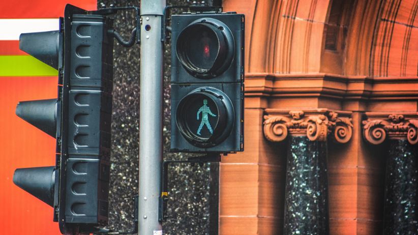 A traffic light showing when pedestrians may cross.