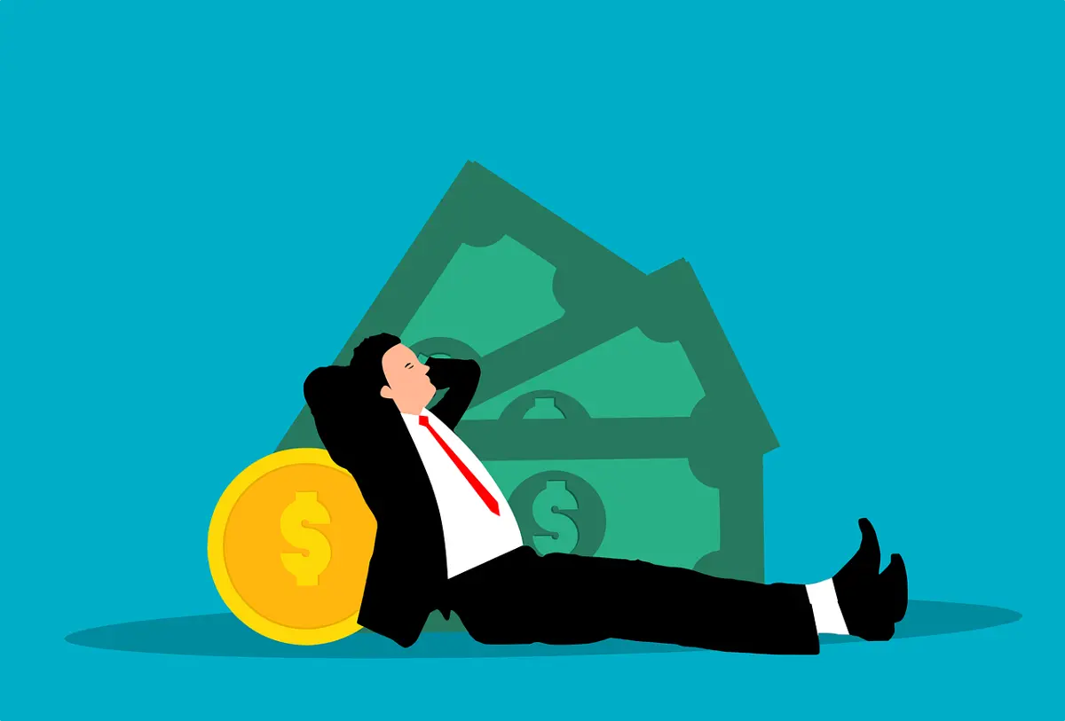 businessman-relaxing-on-a-pile-of-money