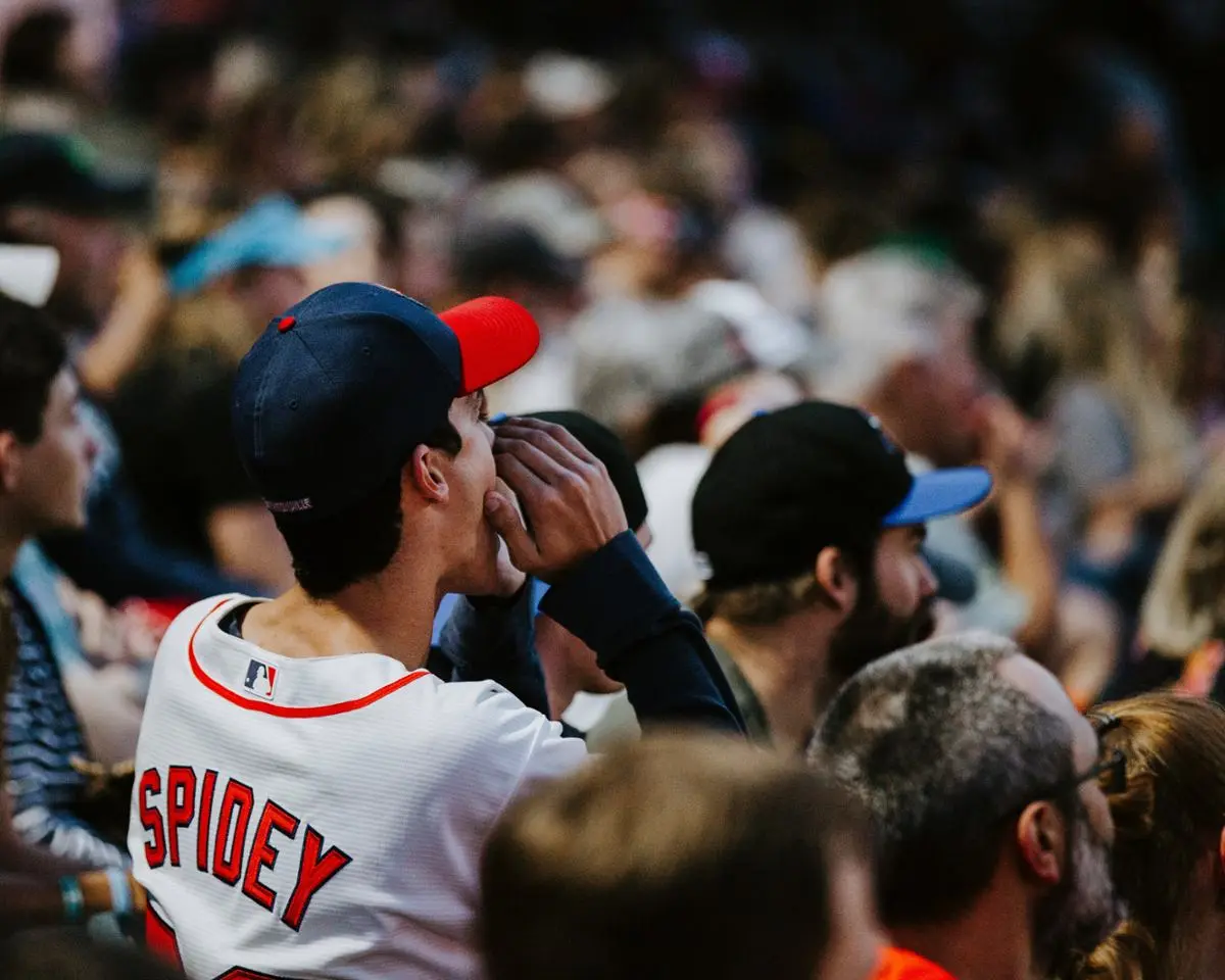 A group of sports fans cheering.