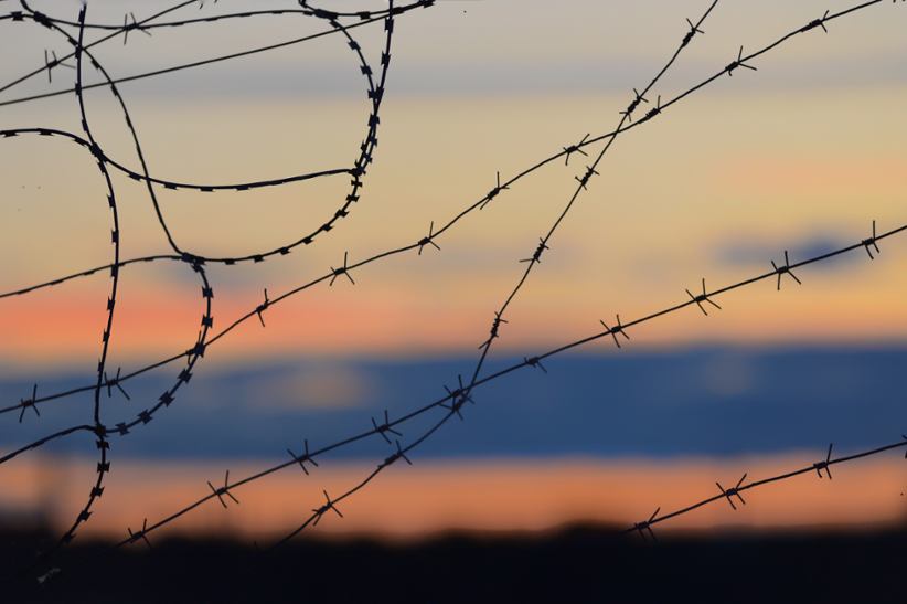 Barbed wire restricting access.