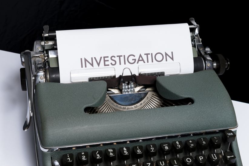 A typewriter that has just spelt the word investigation.